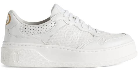 Women's GG embossed sneaker in white leather 